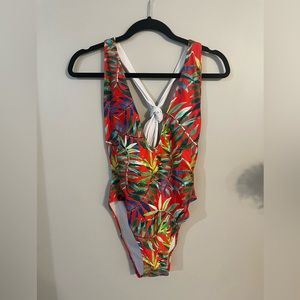 Low cut tropical one piece bathing suit. Never worn only tried on.